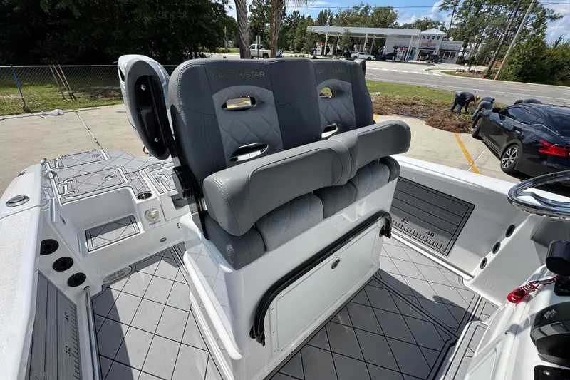 Slide: The Image of 2025 NauticStar 251 Hybrid boat interior with gray seating and modern design. - 32
