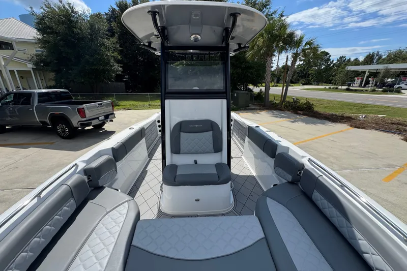 Slide: The Image of 2025 NauticStar 251 Hybrid boat interior with gray seating and modern design. - 25