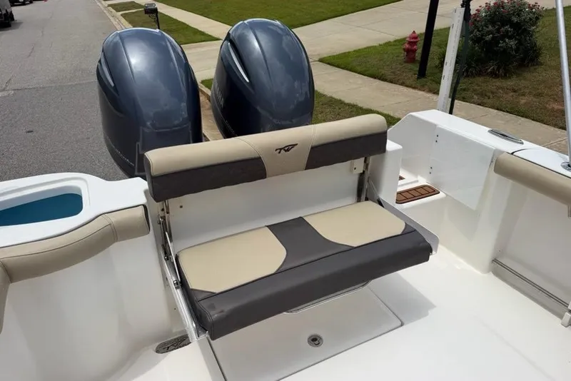 Slide: The Image of 2022 Tidewater 272 CC Adventure boat with dual engines and comfortable seating. - 8