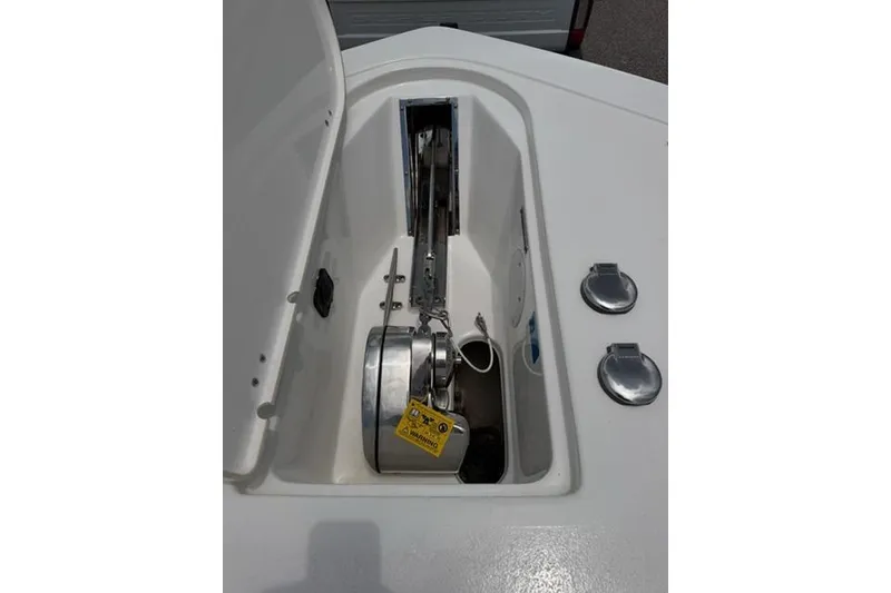 Slide: The Image of Anchor compartment of 2022 Tidewater 272 CC Adventure boat, featuring stainless steel components. - 12