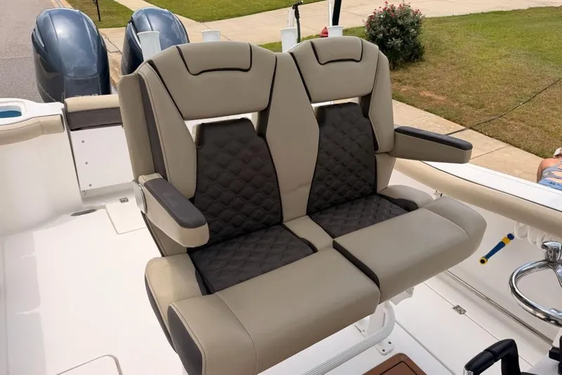 Slide: The Image of Luxury seating on 2022 Tidewater 272 CC Adventure boat, featuring dual engines. - 13