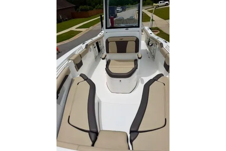 Slide: The Image of 2022 Tidewater 272 CC Adventure boat interior with beige seating and modern design. - 10