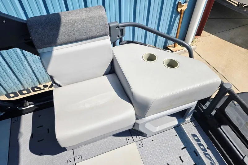 Slide: The Image of 2023 Sea-Doo Switch Cruise 21 seating area with cup holders, gray upholstery. - 29