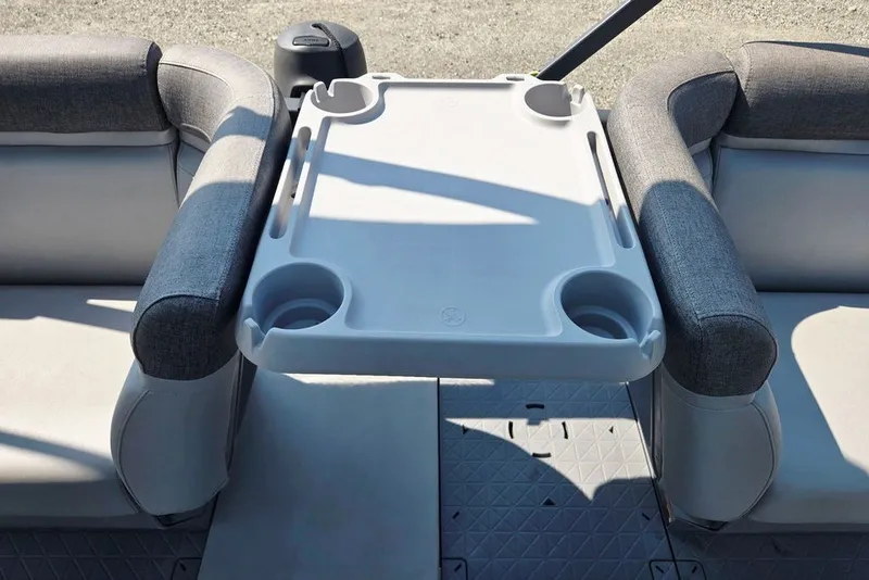 Slide: The Image of 2023 Sea-Doo Switch Cruise 21 interior with cushioned seating and a central table. - 39