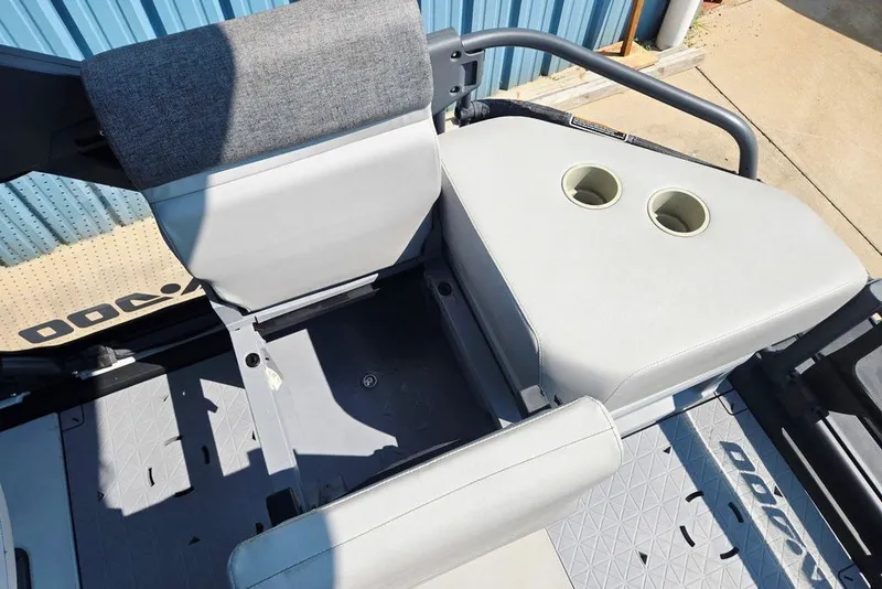 Slide: The Image of 2023 Sea-Doo Switch Cruise 21 interior seating with cup holders, showcasing modern design. - 33