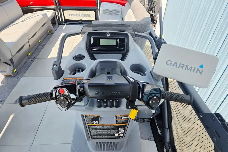 Slide: The Image of 2023 Sea-Doo Switch Cruise 21 dashboard with Garmin navigation system and controls. - 37