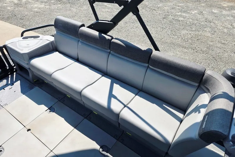 Slide: The Image of 2023 Sea-Doo Switch Cruise 21 boat seating area with gray cushioned seats. - 15