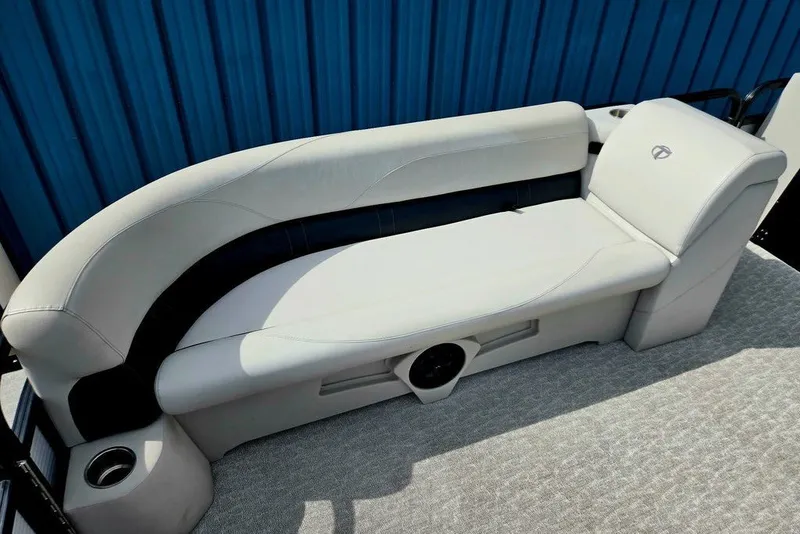Slide: The Image of 2020 Tahoe 225 boat seating with gray upholstery and integrated cup holder. - 19