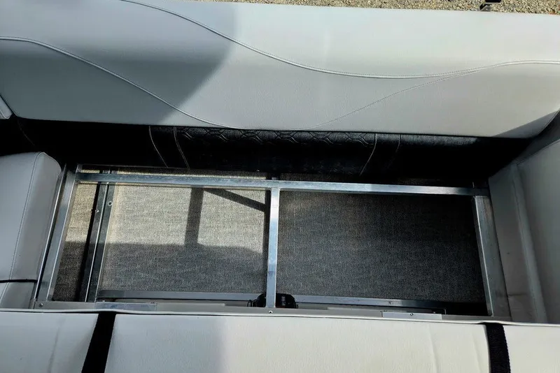 Slide: The Image of Interior view of a 2020 Tahoe 225 boat seat with storage compartment. - 27