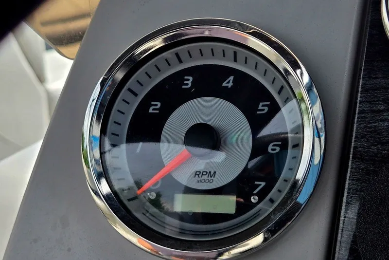 Slide: The Image of Close-up of a 2020 Tahoe 225 tachometer displaying RPM readings. - 33