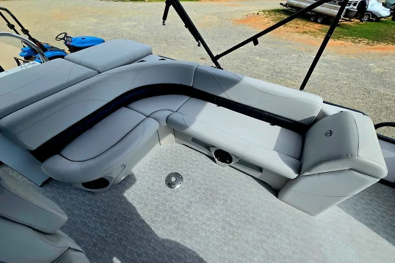 Slide: The Image of Luxurious seating on a 2020 Tahoe 225 boat, featuring sleek gray upholstery. - 29