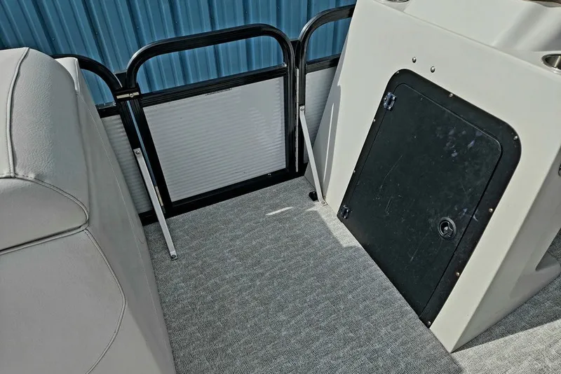 Slide: The Image of Interior of a 2020 Tahoe 225 boat, featuring seating and storage compartment. - 17