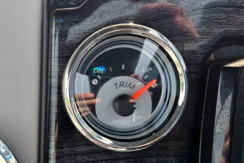 Slide: The Image of Close-up of a 2020 Tahoe 225 trim gauge with reflective surface. - 35