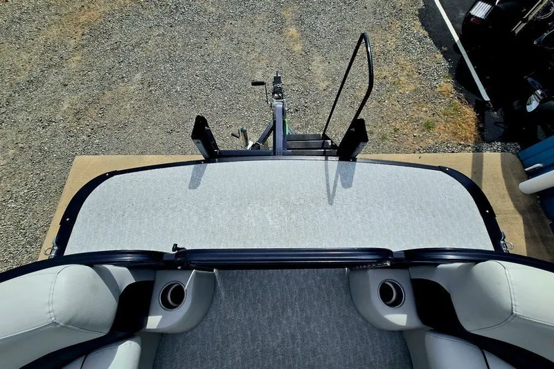 Slide: The Image of 2020 Tahoe 225 boat interior with seating and cup holders, viewed from above. - 23