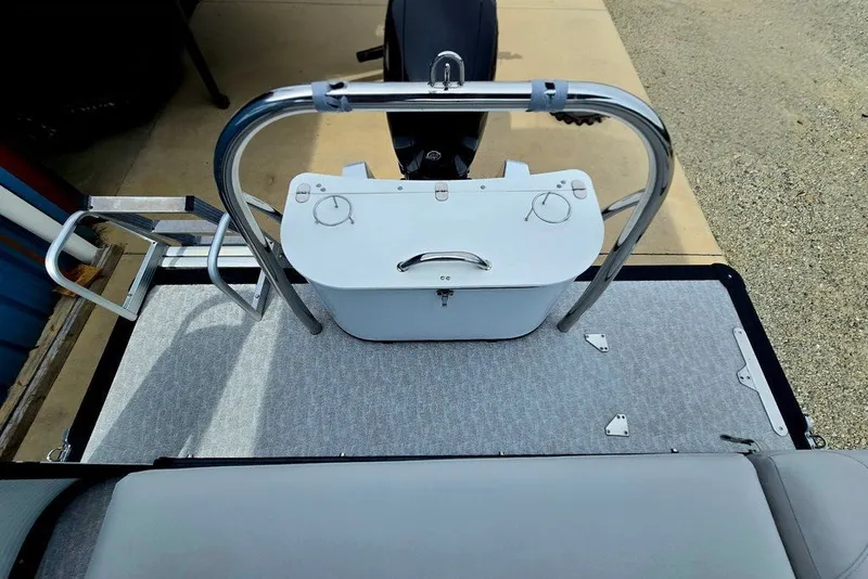 Slide: The Image of 2020 Tahoe 225 boat deck with seating and storage compartment. - 43