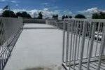 Slide: The Image of Rooftop with white railing under blue sky, Masterfab 65, 1982 model. - 9