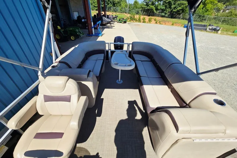 Slide: The Image of 2018 Sun Tracker Party Barge 22 XP3 interior with beige seating and table. - 31