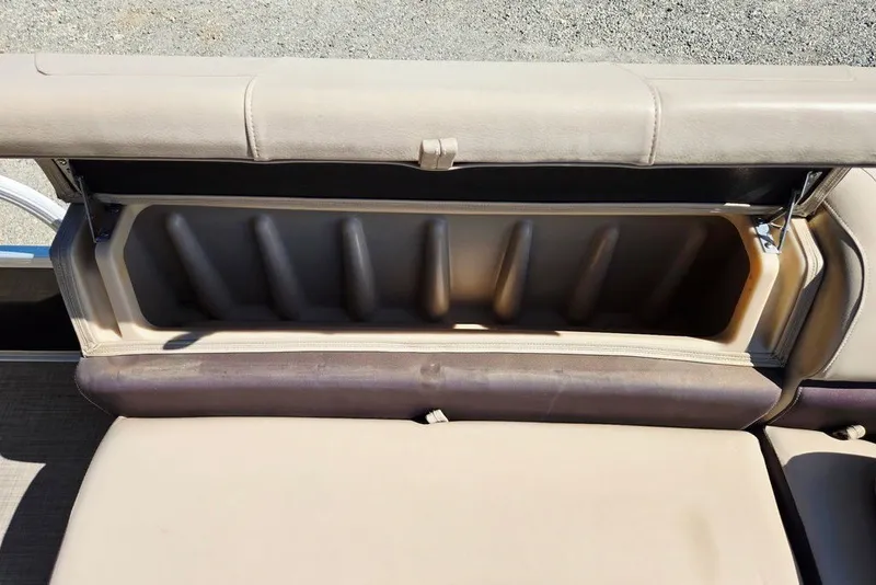 Slide: The Image of 2018 Sun Tracker Party Barge 22 XP3 storage compartment with beige seating. - 15