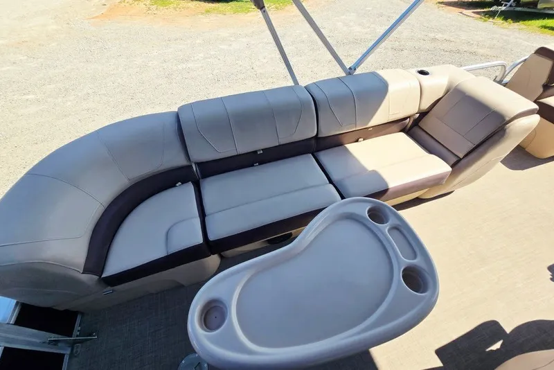 Slide: The Image of 2018 Sun Tracker Party Barge 22 XP3 interior with plush seating and table. - 34