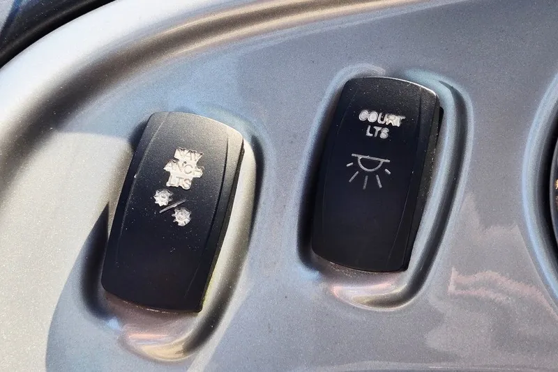 Slide: The Image of Dashboard switches on a 2018 Sun Tracker Party Barge 22 XP3 boat. - 21