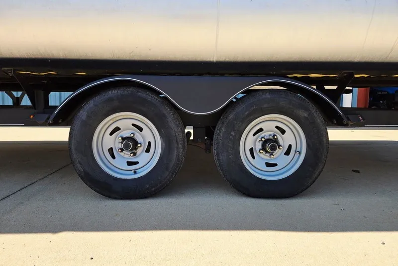 Slide: The Image of Trailer wheels of a 2018 Sun Tracker Party Barge 22 XP3 pontoon boat. - 18