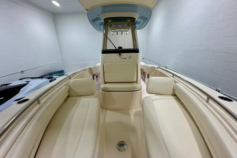 Slide: The Image of 2023 Grady-White Fisherman 257 boat interior with beige seating and modern helm. - 21