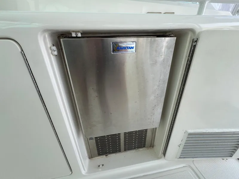 Slide: The Image of Raritan ice maker on 1999 Cabo 45 Express yacht. - 18