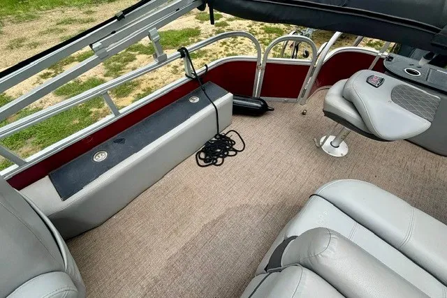 Slide: The Image of Interior of a 2023 Ranger 223F boat with seating and storage. - 9