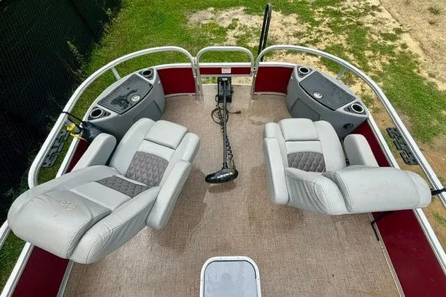 Slide: The Image of 2023 Ranger 223F boat interior with two cushioned seats and control panel. - 17