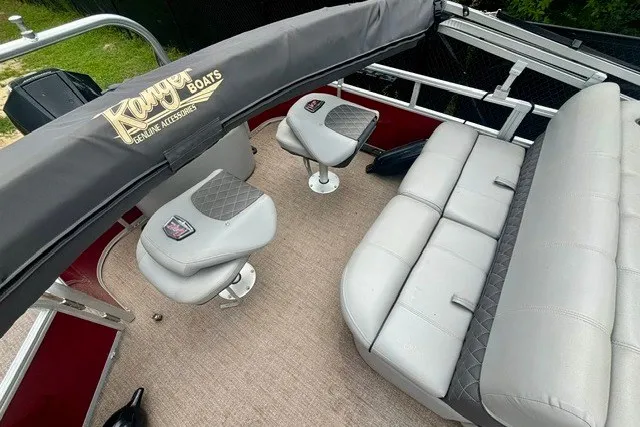 Slide: The Image of 2023 Ranger 223F boat interior with cushioned seating and branded accessories. - 8