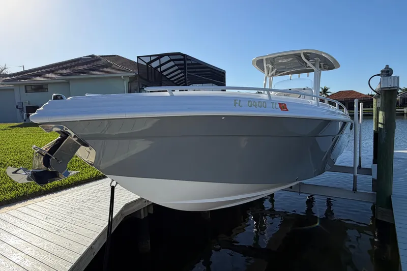Slide: The Image of 2022 Glasstream 328 Pro-XS boat docked, showcasing sleek design and modern features. - 52