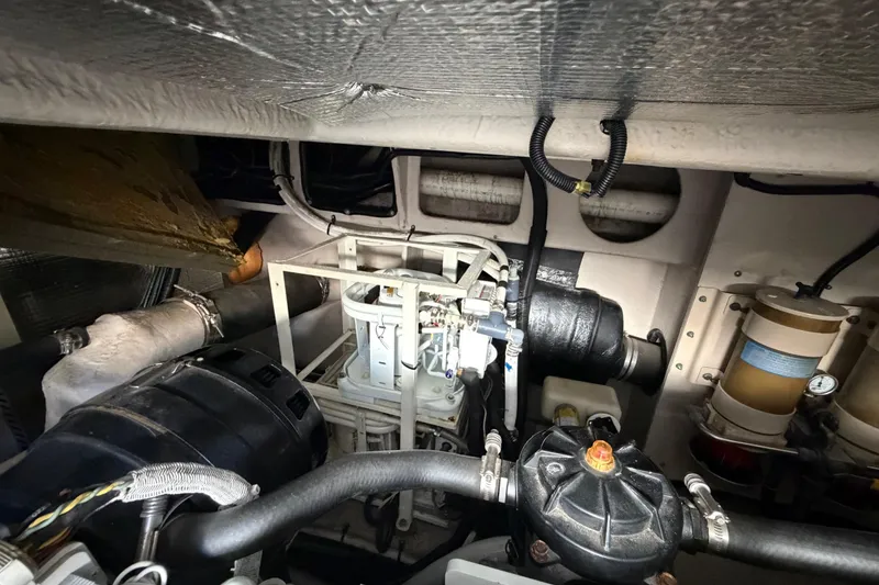 Slide: The Image of Engine room of a 2001 Sea Ray Sundancer 510 yacht, showcasing mechanical components. - 51