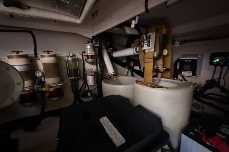 Slide: The Image of Engine room of a 2001 Sea Ray Sundancer 510 with mechanical components and gauges. - 49