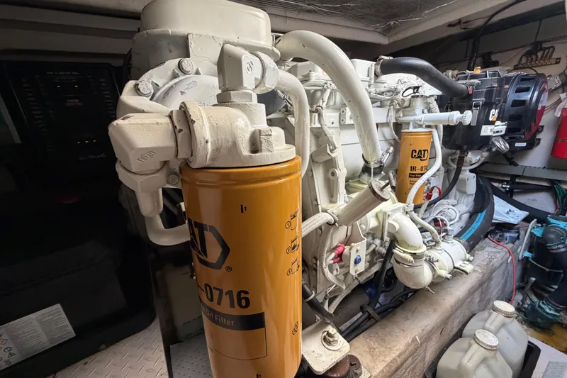 Slide: The Image of Engine room of a 2001 Sea Ray Sundancer 510 with CAT filters visible. - 48