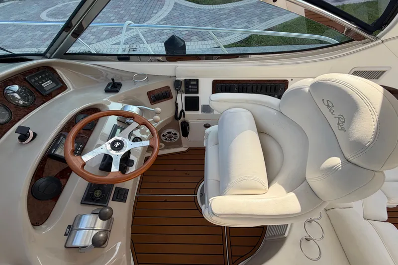 Slide: The Image of Cockpit of 2001 Sea Ray Sundancer 510 with steering wheel and captain's chair. - 14