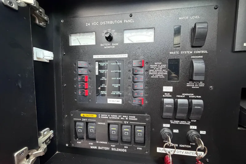 Slide: The Image of Control panel of a 2001 Sea Ray Sundancer 510 yacht, featuring various switches and indicators. - 40