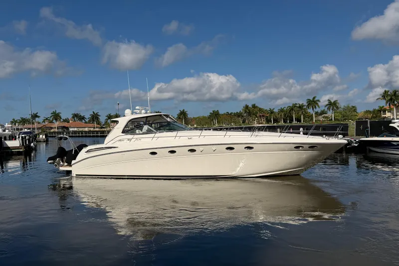 The Image of 2001 Sea Ray Sundancer 510 yacht docked in a sunny marina setting. - 0
