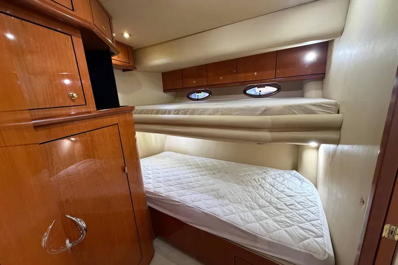 Slide: The Image of Luxurious cabin interior of 2001 Sea Ray Sundancer 510 yacht with wooden cabinetry. - 36