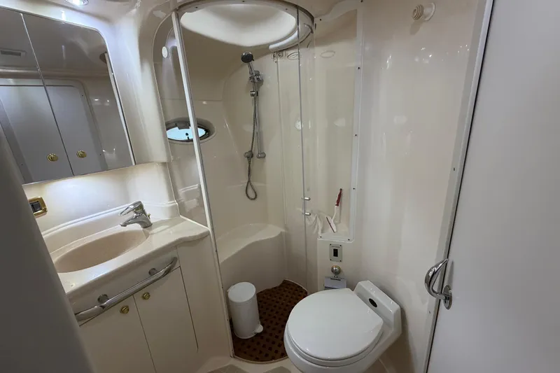 Slide: The Image of Luxurious bathroom in 2001 Sea Ray Sundancer 510 yacht, featuring shower, sink, and toilet. - 38