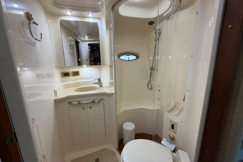 Slide: The Image of Luxurious bathroom in 2001 Sea Ray Sundancer 510 yacht, featuring shower, sink, and toilet. - 37