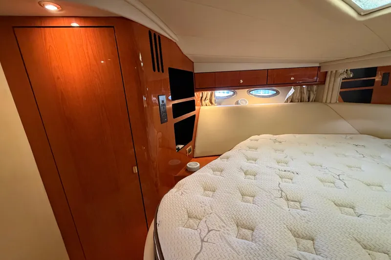 Slide: The Image of Luxurious cabin interior of 2001 Sea Ray Sundancer 510 yacht with plush bedding. - 31
