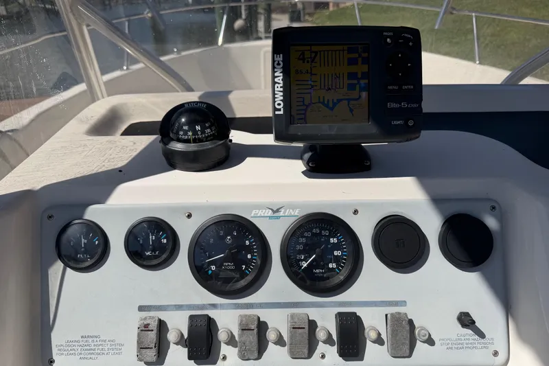 Slide: The Image of Dashboard of a 1995 Pro-Line 21 Sport boat with navigation instruments. - 11