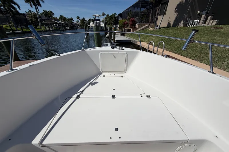 Slide: The Image of 1995 Pro-Line 21 Sport boat docked in a sunny canal setting. - 17