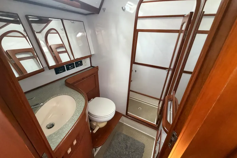 Slide: The Image of Luxurious bathroom interior of 2009 Hylas 54 yacht with wooden accents and modern fixtures. - 22