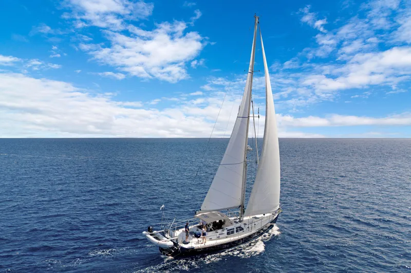 Slide: The Image of Sailing yacht Hylas 54 (2009) cruising on open ocean under clear blue skies. - 2