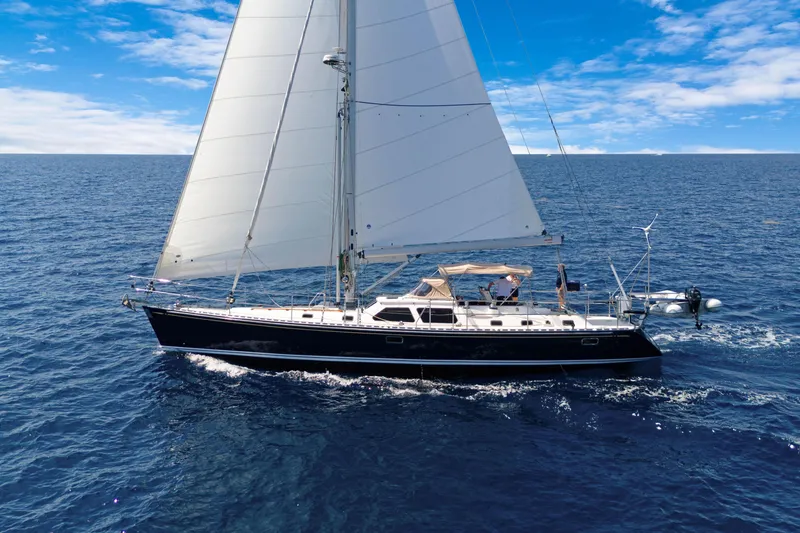Slide: The Image of Sailing yacht Hylas 54 (2009) cruising on open ocean under clear blue skies. - 3