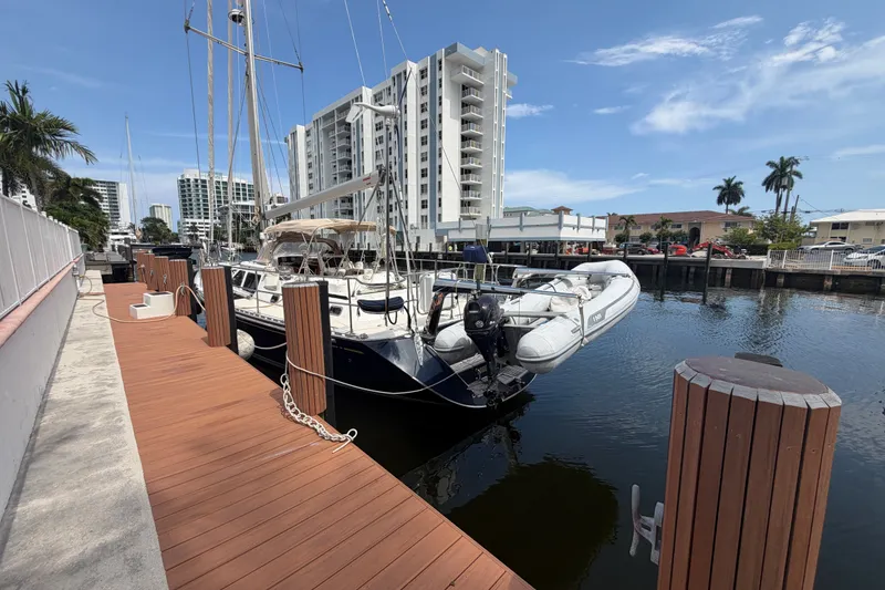 Slide: The Image of Docked 2009 Hylas 54 yacht with inflatable boat, urban waterfront setting. - 41