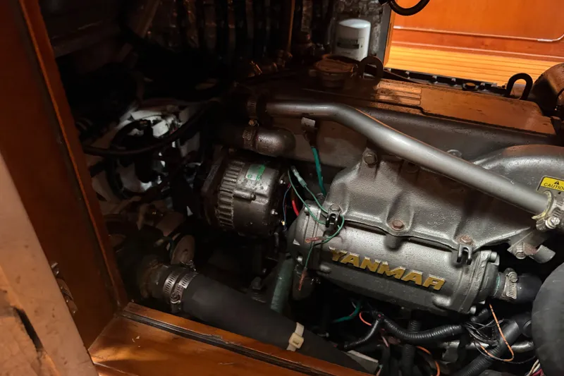 Slide: The Image of Engine compartment of a 2009 Hylas 54 yacht featuring a Yanmar engine. - 44