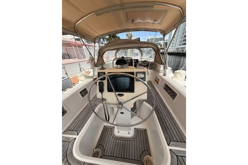 Slide: The Image of Cockpit of 2009 Hylas 54 yacht with steering wheel and navigation equipment. - 28