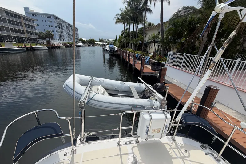 Slide: The Image of Hylas 54 yacht docked in a canal with inflatable dinghy, 2009 model. - 30